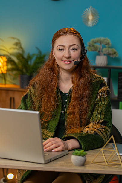 istock Business woman wearing headset freelance worker call center or support service operator helpline 2210725082