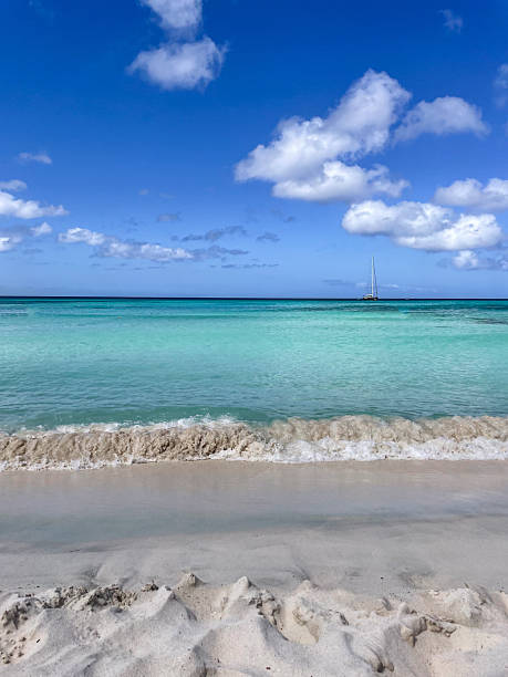 istock Tranquil Beach with Clear Blue Water and White Sand 2210731792