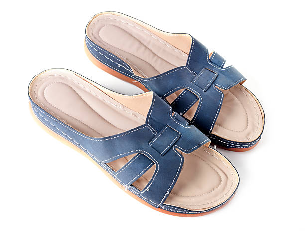 Leather women sandals in front of white background