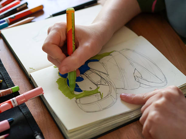 istock A young woman draws in a sketchbook 2210738203