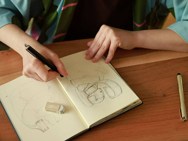 istock A young woman draws in a sketchbook 2210740127