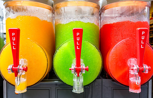 istock Colorful beverage dispensers with bright options serving refreshing drinks in a lively setting at a summer festival 2210740973
