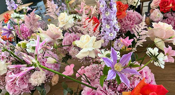 istock Decoration for a wedding celebration - Beautiful bouquet with pink clematis 2210743717
