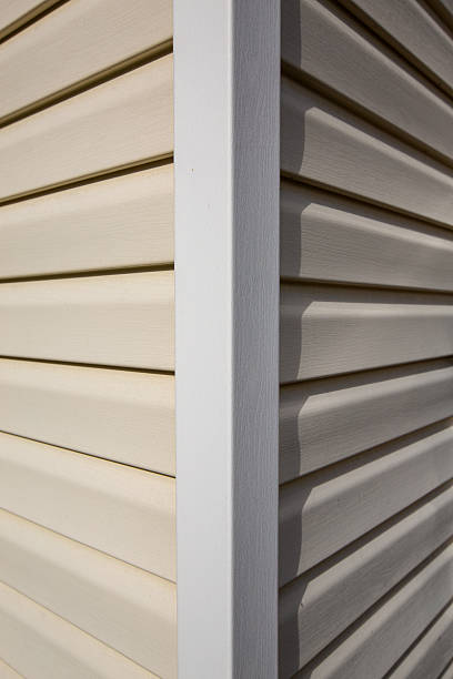 istock The corner of a house made with siding planks 2210743968