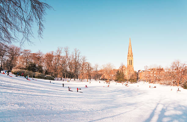 People making the most of the snow on a hill in Glasgow's Queen's Park.