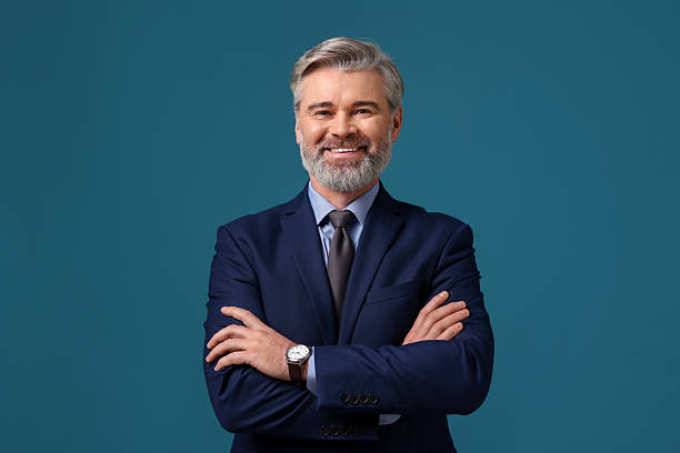 istock Banker with crossed arms on blue background 2210747388