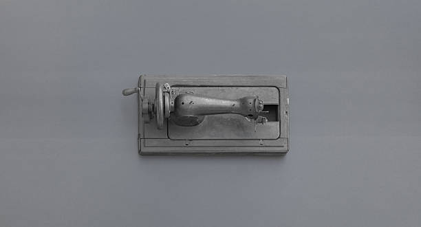 istock retro vintage sewing machine isolated on black background 2210748823