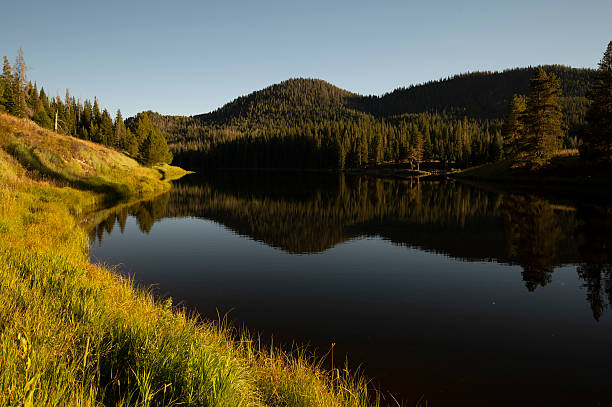 As the sun dips in the western sky, the beauty and stillness of Hahn's Peak Lake in northern Colorado radiated peace and solitude.