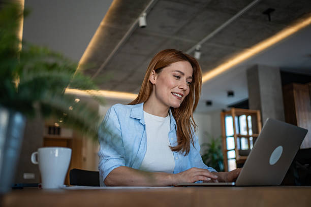 istock Happy freelancer working from home on laptop in modern apartment 2210751609