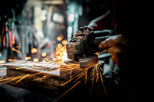Metal Grinding with Sparks Flying in a Workshop Setting