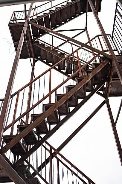 istock Rustic Outdoor Staircase with Geometric Structure Against Clear Sky 2210751769