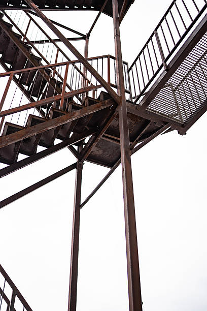 istock Rustic Industrial Staircase Against a Bright White Sky 2210751796