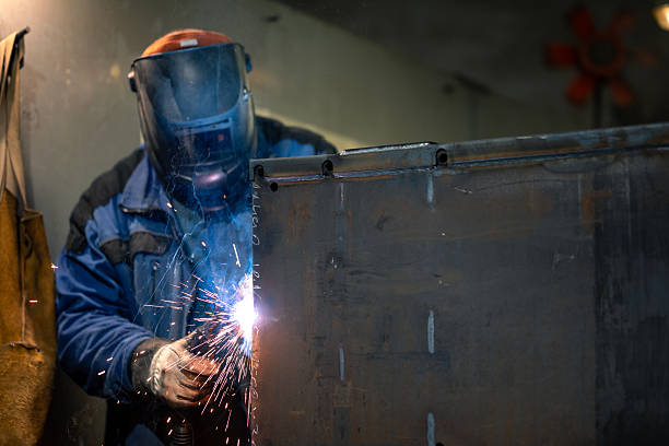istock Utility worker in action - welder 2210753135