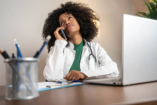 istock Focused Black Female Doctor on Call 2210753928