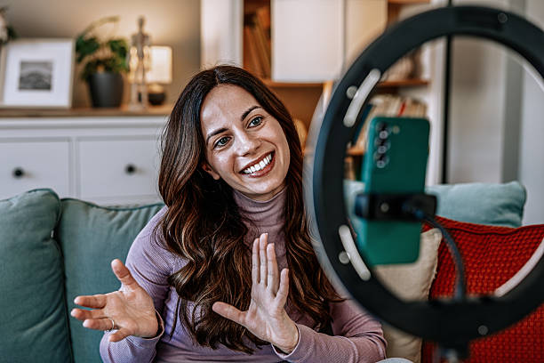istock Woman filming educational content for online courses and e-learning 2210754486