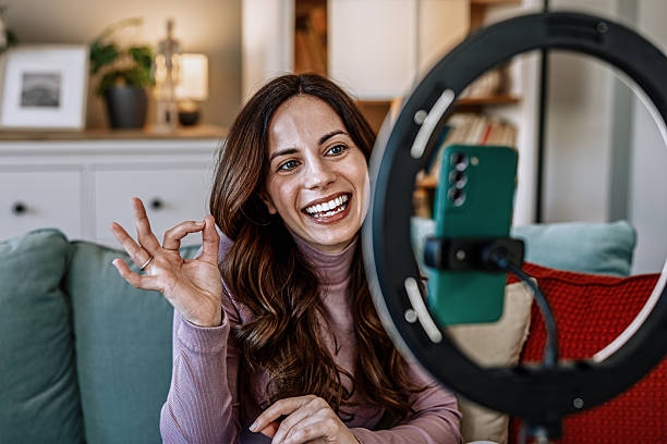 istock Woman filming educational content for online courses and e-learning 2210754594