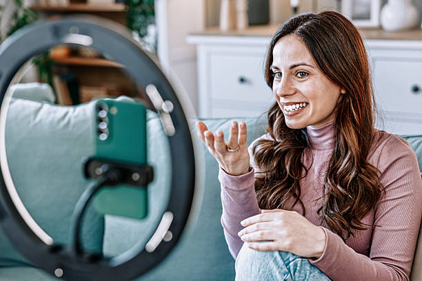 istock Woman filming educational content for online courses and e-learning 2210754598