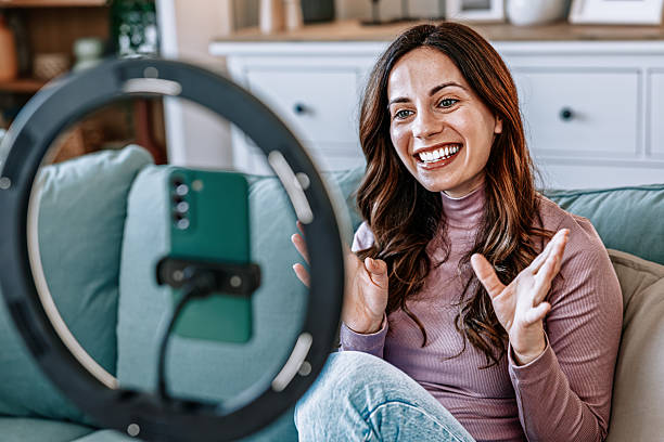 istock Woman filming educational content for online courses and e-learning 2210754680