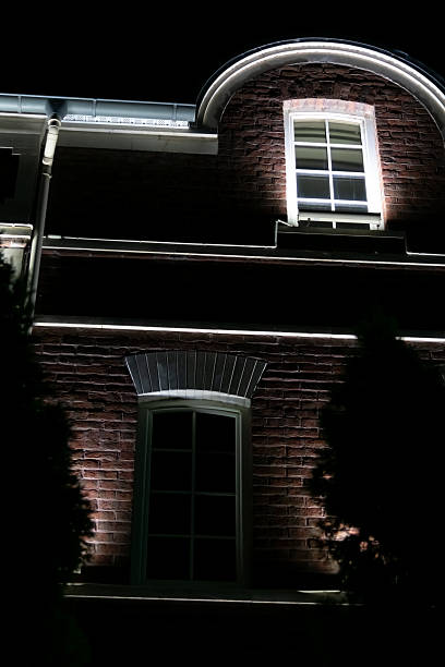 istock Building illuminated at night showcasing architectural features and shadows 2210757032