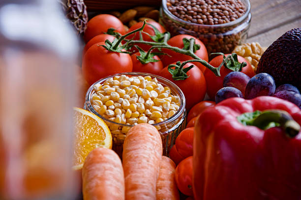 Red tomatoes, lettuce leaves on the table close-up. Vegetables for salad on the kitchen table. High quality photo