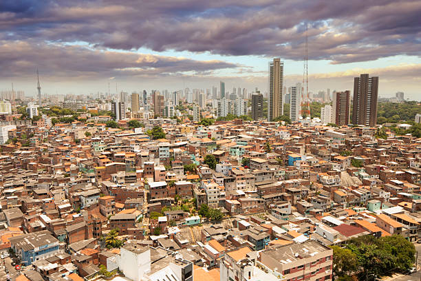 istock Urban social contrast. Favela and buildings 2210758953