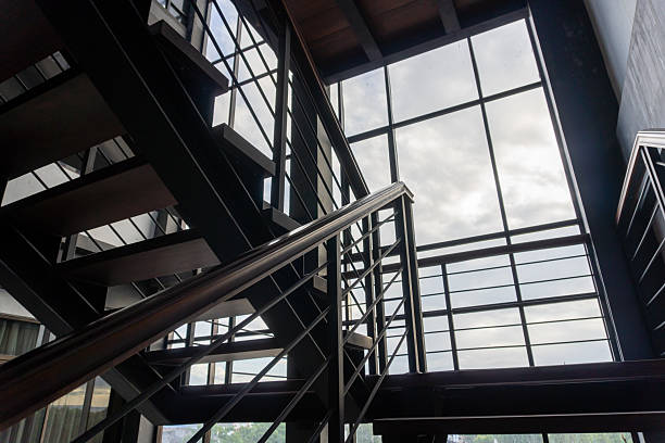 istock Modern Interior Staircase with Large Window Allowing Natural Light Inside 2210759834