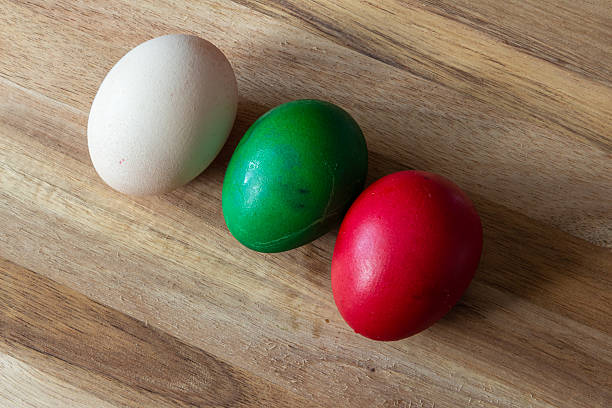 Easter eggs with flowers - wood background