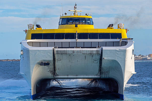 Porec, Croatia - May 21, 2025: Prince of Venice large catamaran from Adriatic Lines by Kompas is moored at port under cloudy sky. Sleek vessel is ready for passenger transport across the Adriatic Sea.