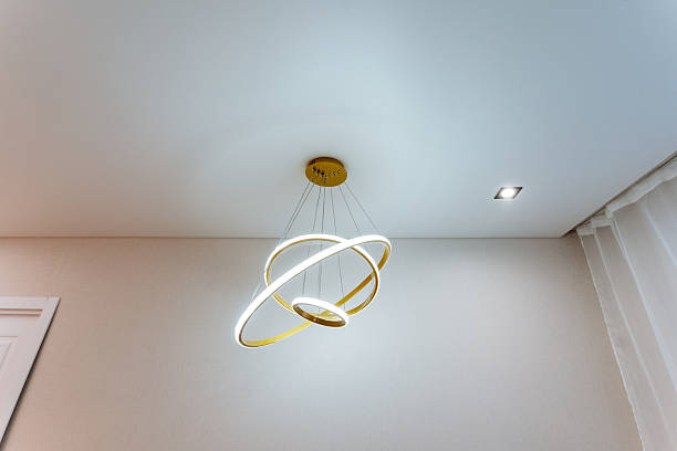 istock An elegant ceiling light fixture provides generous illumination and significantly enhances the overall ambiance of the room, resulting in a warm and inviting atmosphere appreciated by all 2210761467