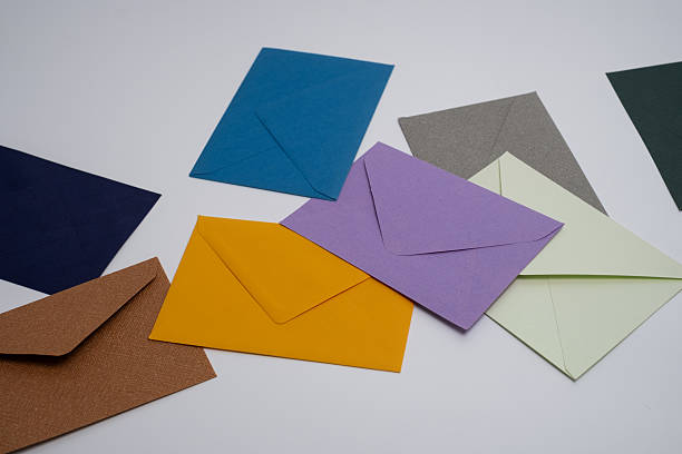 istock Paper envelopes on a light background. New mail, write a message. Send and receive mail. Postal delivery service. Empty envelope, empty space. Communication with people, paperwork. Envelope close-up 2210763806