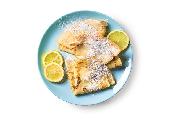 istock Citrus Crepes on plate isolated 2210769548