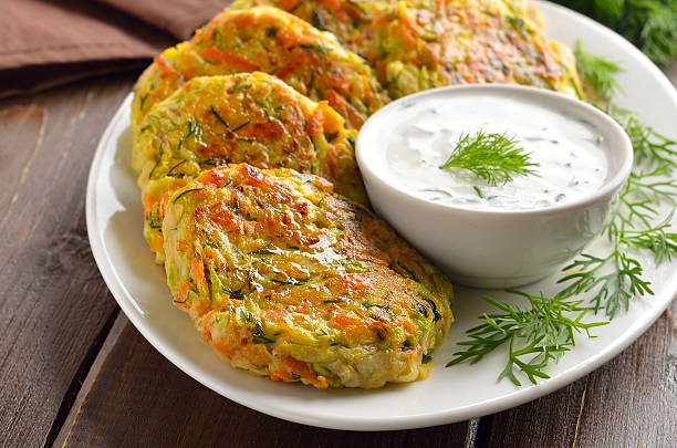 istock Diet vegetable cutlet from zucchini, carrot, herbs on plate 2210769859