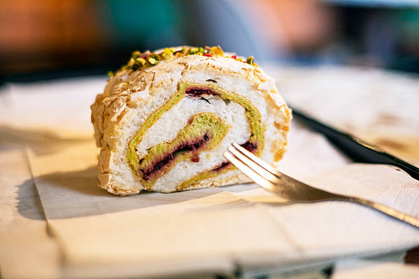 taste meringue roll with pistachio and raspberry. Popular desserts