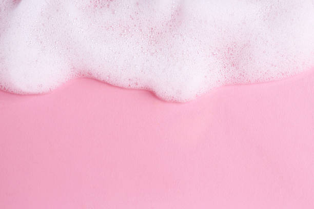 istock Sample of fluffy foam on pink background, top view. Space for text 2210776909