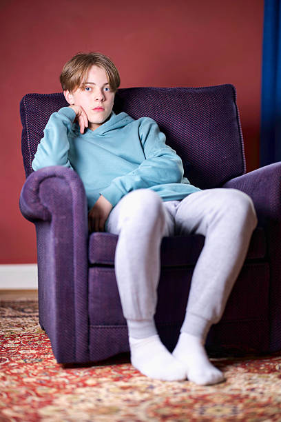 istock Teen boy relaxing at home 2210776956