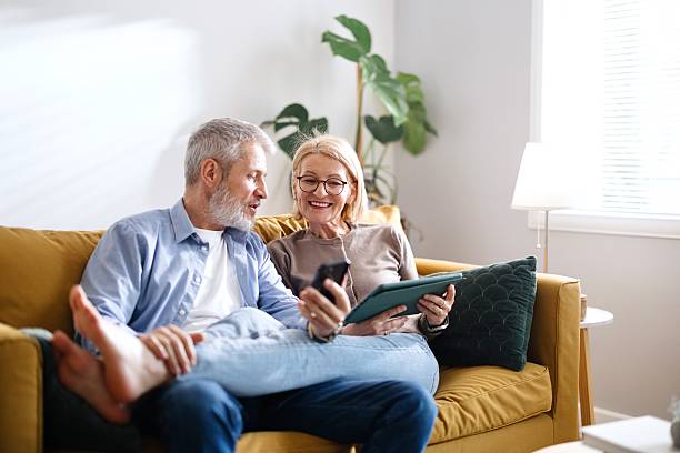 istock Relaxed couple sitting on a sofa 2210777151