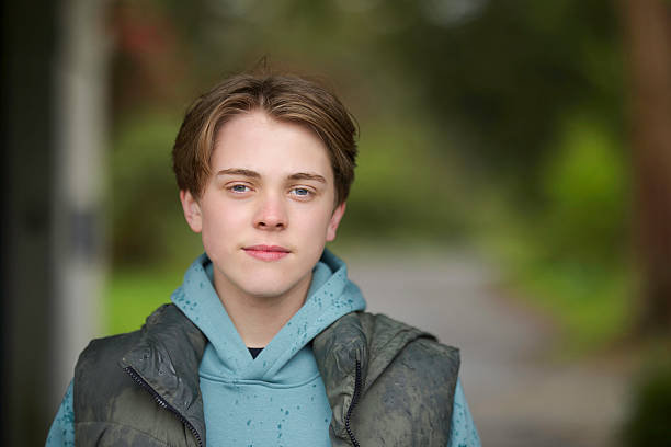 istock Teen boy outdoors on a rainy day 2210777174