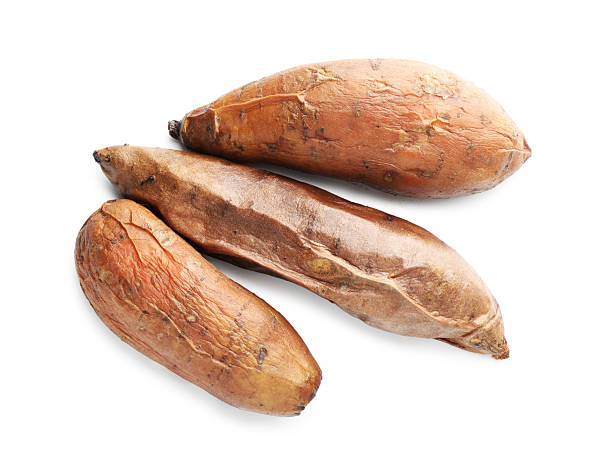 istock Tasty cooked sweet potatoes isolated on white, top view 2210778364