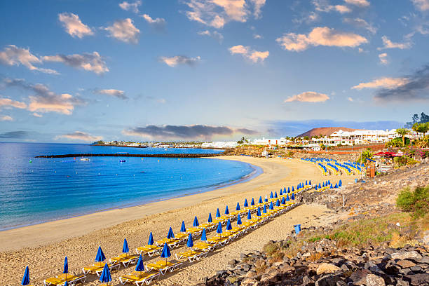 istock scenic empty beach at Playa Blanca in morning sun 2210780358