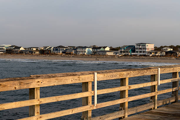 istock Beachfront Homes Seen from Oak Island Pier 2210780712