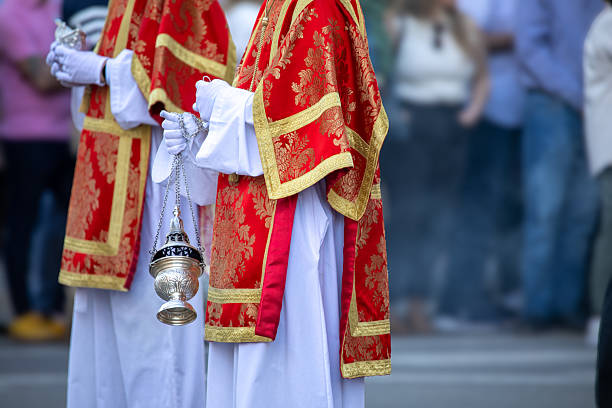 istock Altar boy in Holy Thursday procession attire carrying an incense burner 2210781534