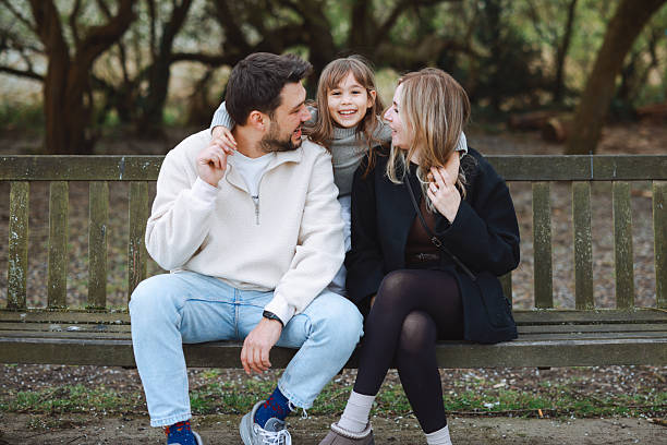 istock Family laughing, having fun in autumn park 2210786664
