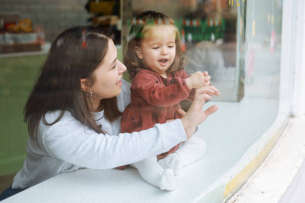 istock Smiling young mother and baby daughter 2210787557