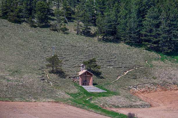 Under the Piano Grande Woods, the Little Church at the Foot of the Pineta Italia