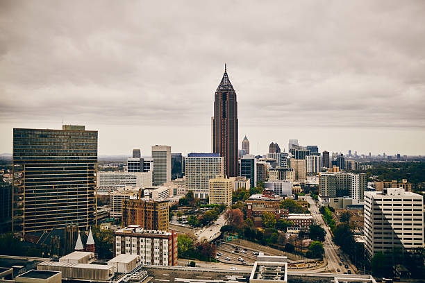Cloudy day view of Atlanta's downtown skyline showcasing iconic skyscrapers, urban architecture, and dynamic cityscape under a muted sky.
