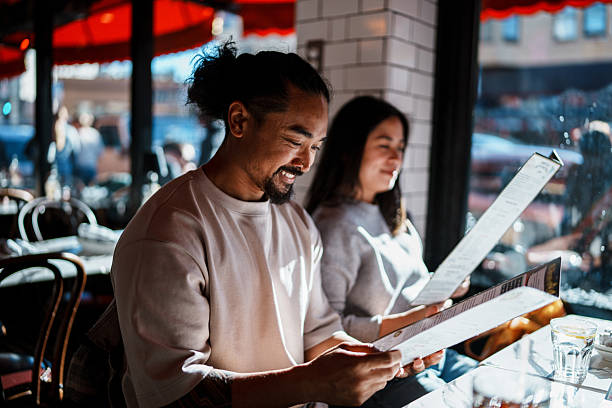 Couple reviewing restaurant menu