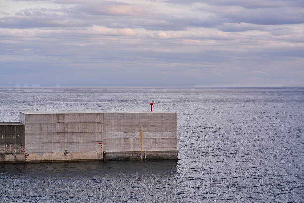 Huge square blocks providing the coastal sea defences/wall at the entrance to Getxo port on the Northern coast of Spain
