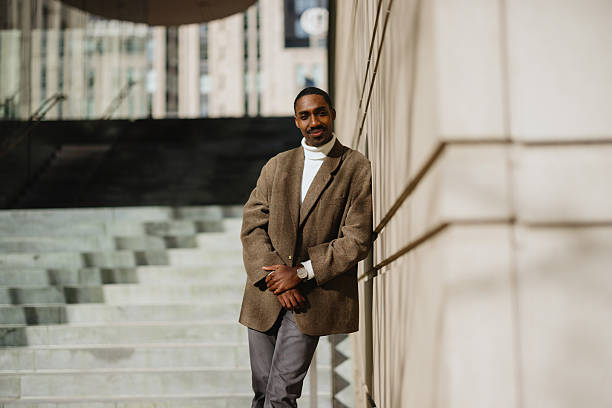 istock Confident Man Standing by Urban Architecture With Modern Style 2210800718
