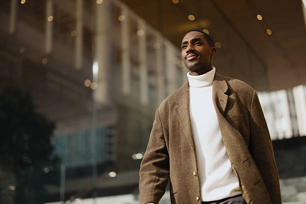 Confident Man Walking Downtown in Stylish Outfit and Warm Lighting