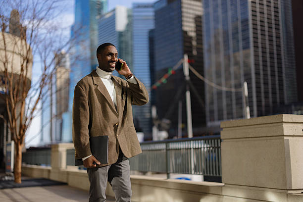 istock Business Professional Talking on Phone Outdoors in Urban Environment 2210800808